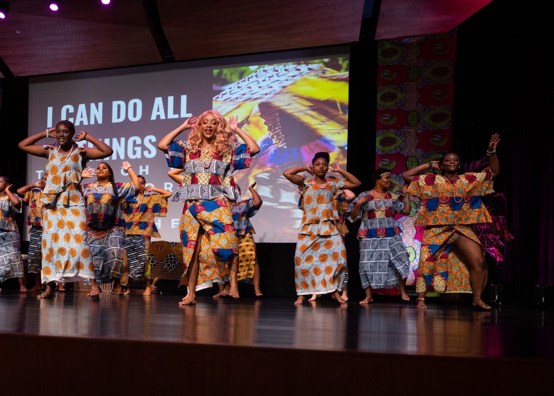 Group of people in colorful African-print clothing