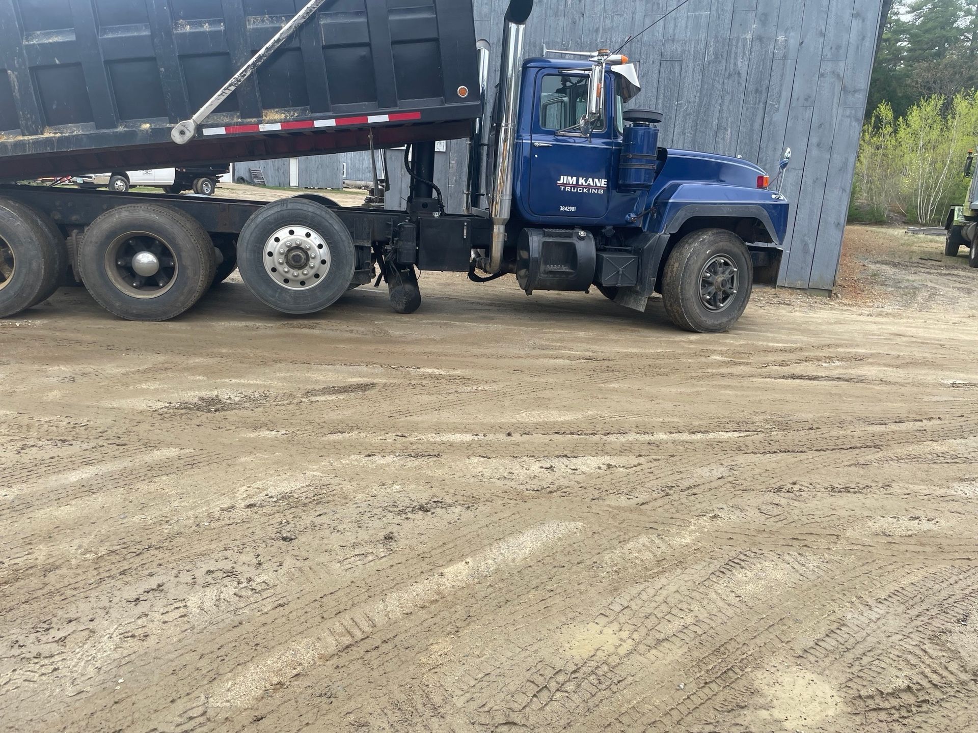 Yellow loader dumping gravel