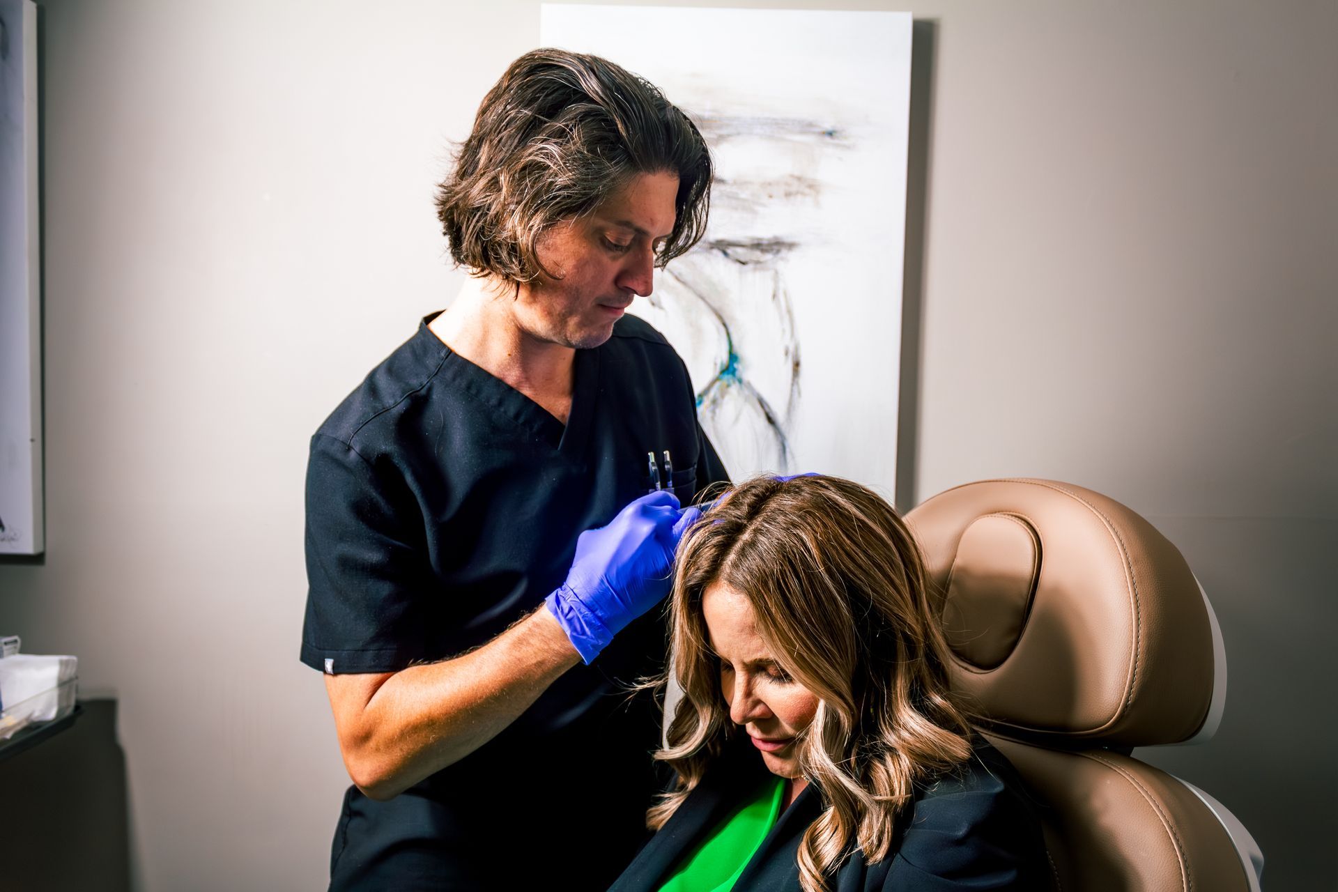 Luke Cenac NP injecting growth factors and exosomes into a scalp for Hair Restoration and Regrowth in Metairie, LA | CHRONOS