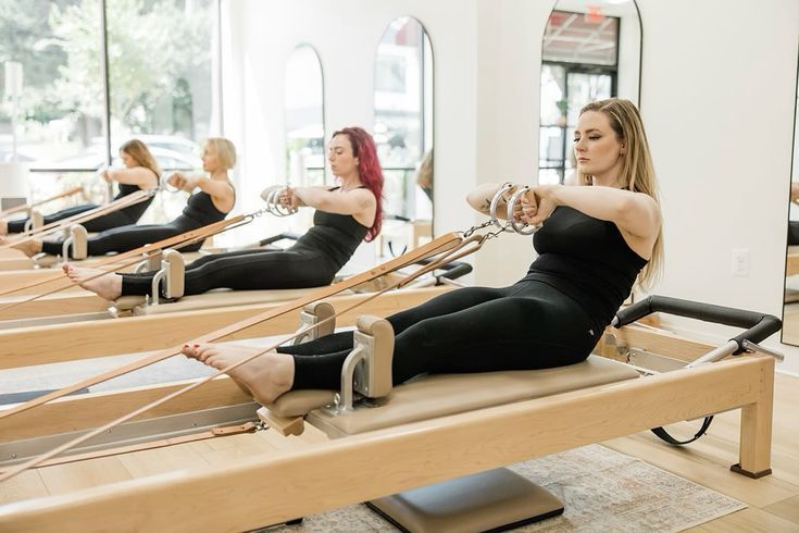 Woman practicing Classical Pilates on a Gratz apparatus at Chronos Pilates Studio in Metairie
