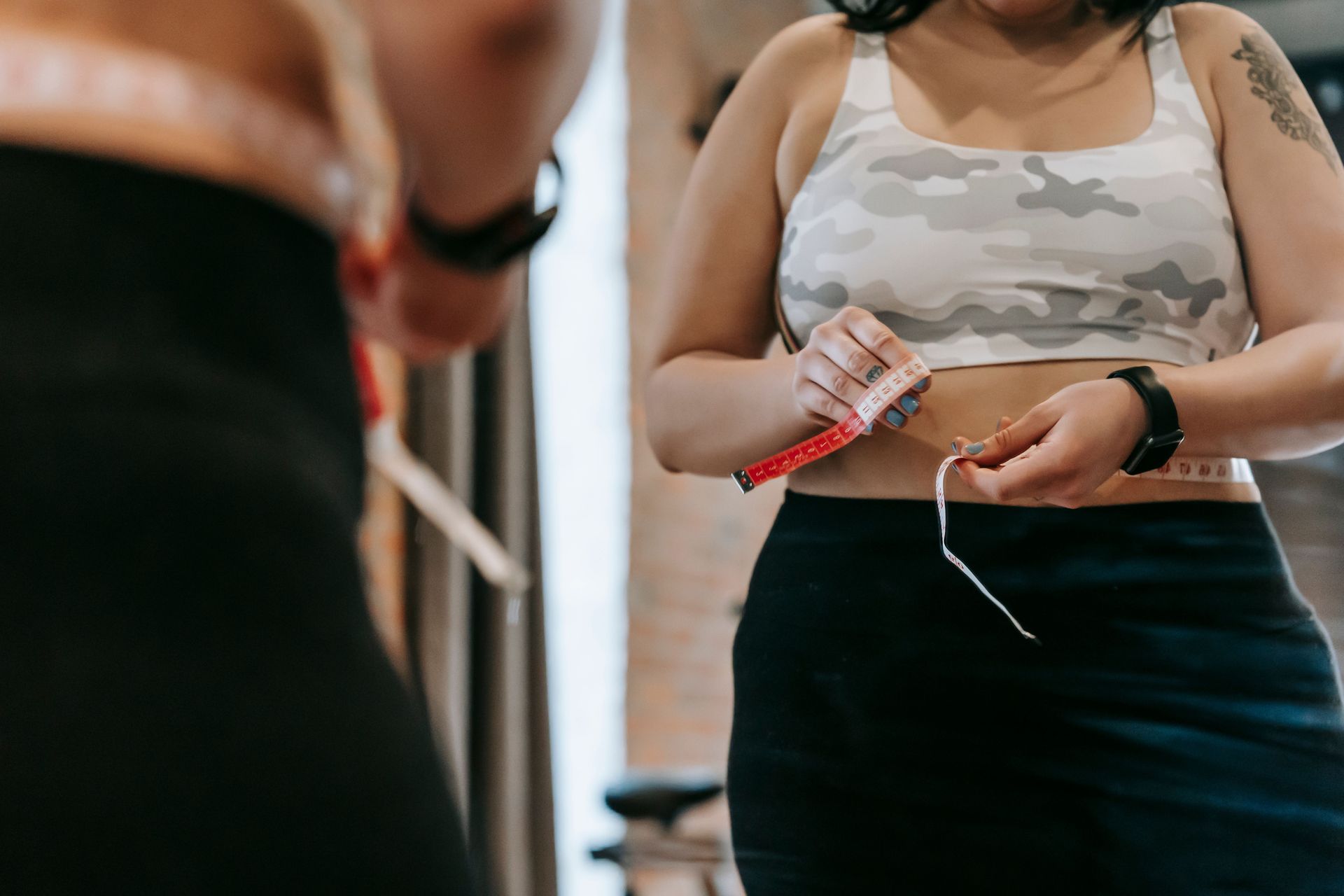 Patient reviewing weight loss treatment options and program costs with a medical provider.