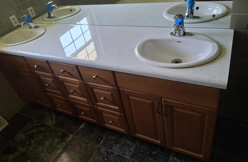 A bathroom with a bathtub , sink , toilet and shower.