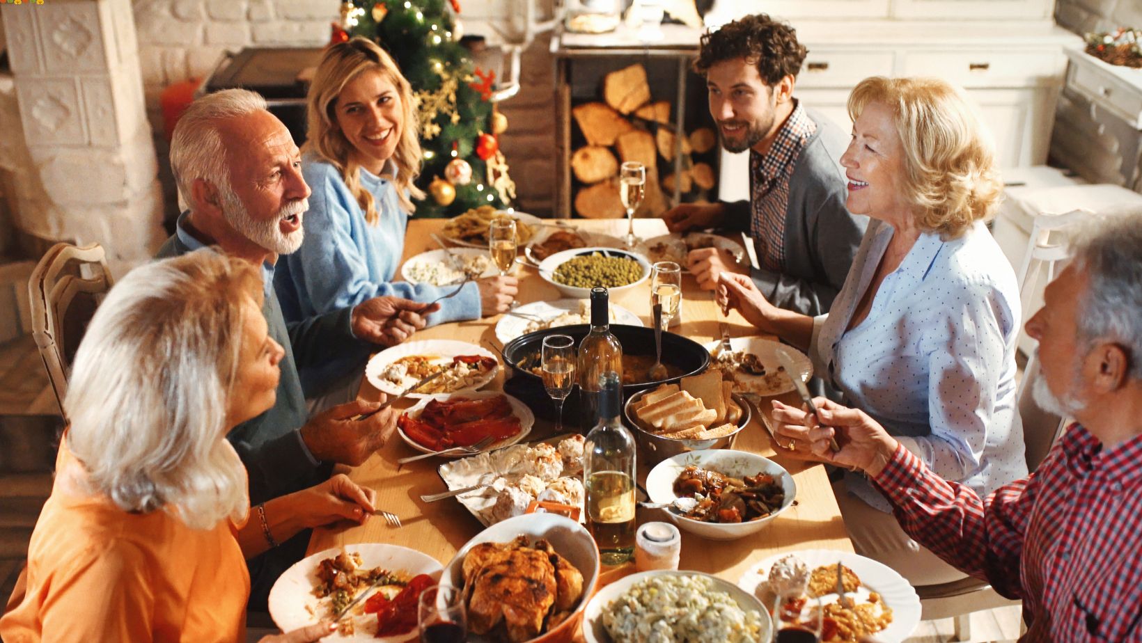 Friends and Family having a Christmas or Thanksgiving meal together. Partaking in Turkey, Stuffing, Mashed Potatoes, Pumpkin Pie, Wine, Cranberry Sauce, laughing and smiling while enjoying pumpkin spice and holiday time together making memories during the holiday season. 