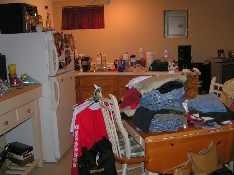 Piles of Clothes on Table – Orange County, CA – Designing Women of OC