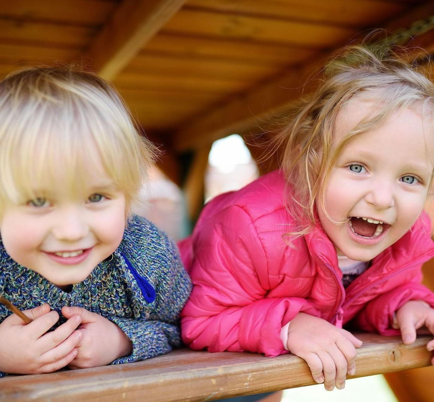 Happy siblings smiling and laughing
