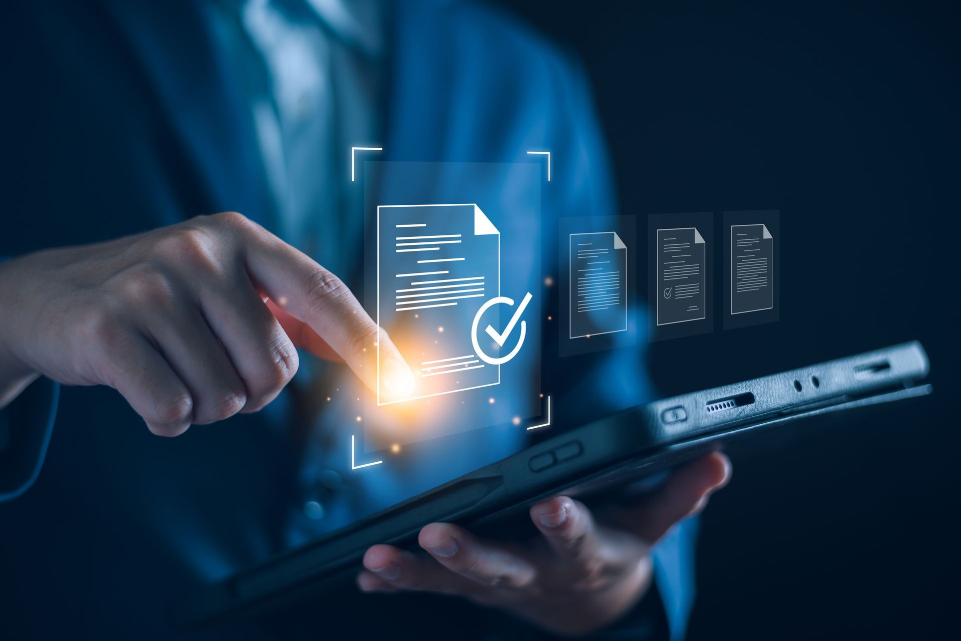 A man is holding a tablet with a digital signature on it.