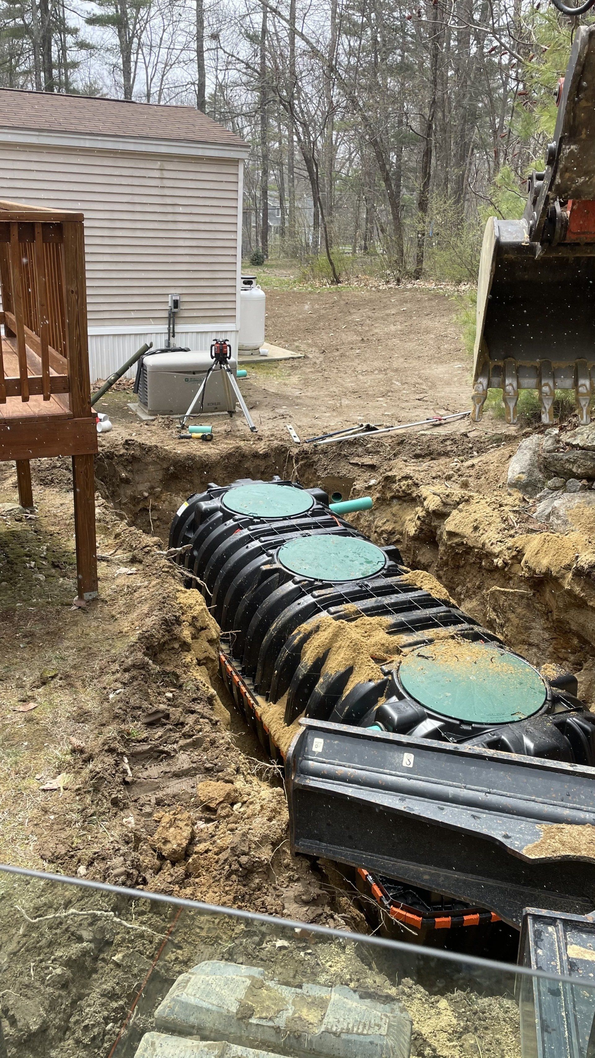 Man Setting Up Septic System — Northwood, NH — Tasker MD Construction