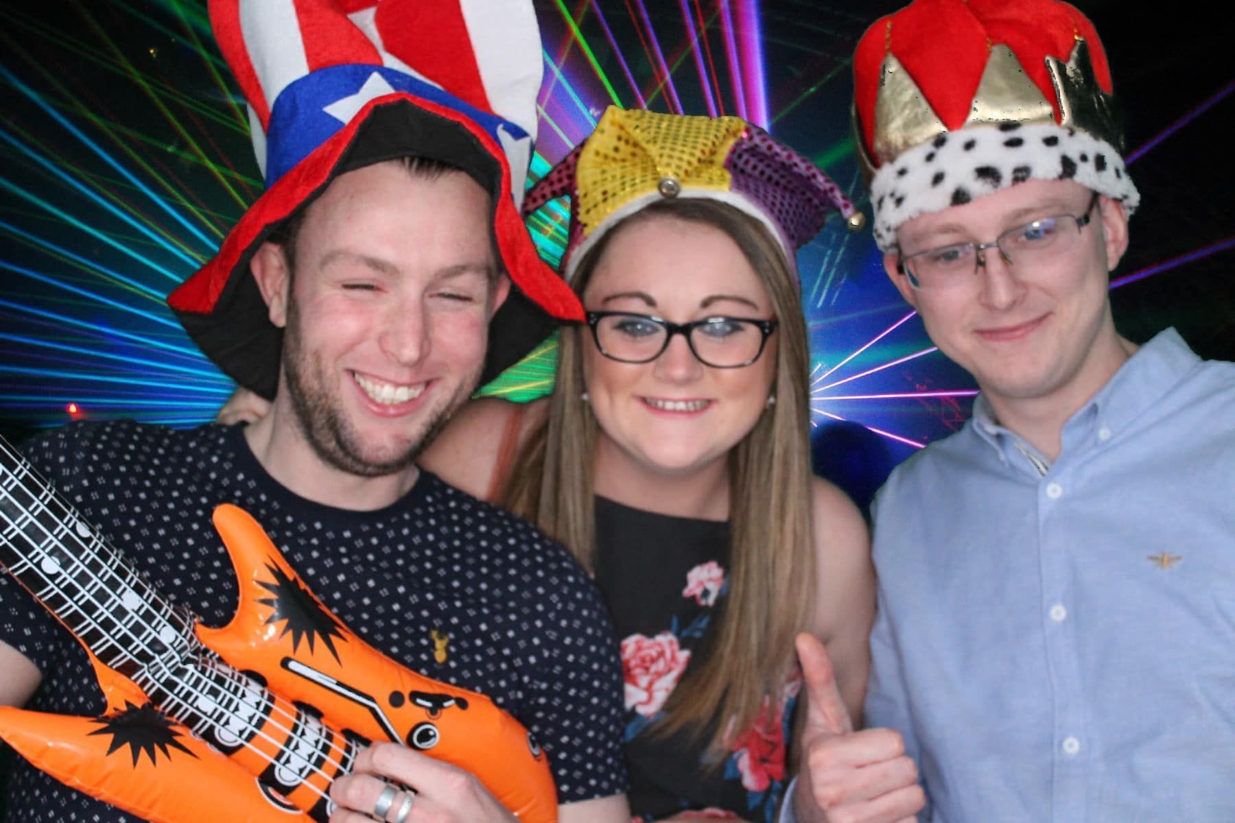 Photo of 3 friends at a party in the Photo Booth