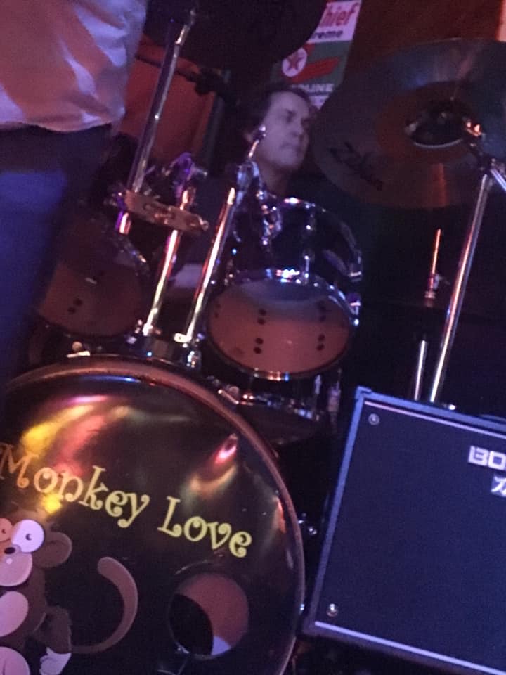 A drum set with monkey love written on it