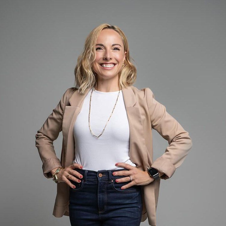 Margaret standing with her hands on her hips and smiling.