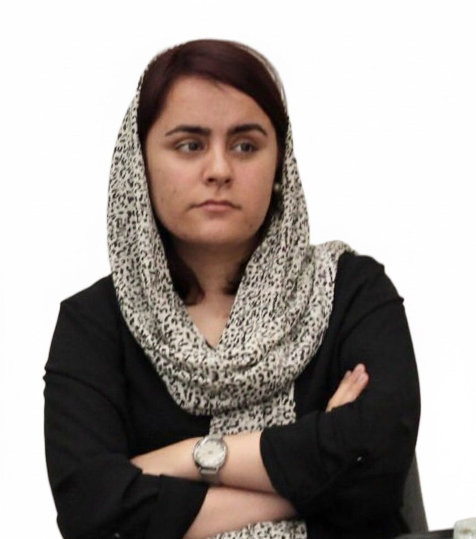 Two people shaking hands, a beige jacket on the left and a black sleeve on the right, white background.