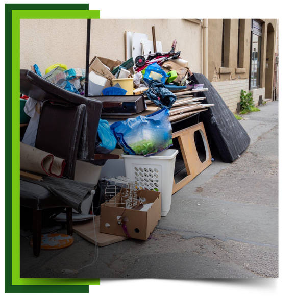 A pile of garbage in front of building