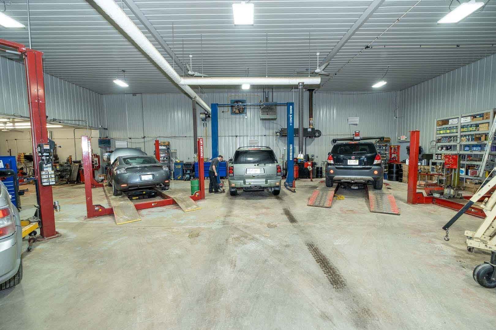Our Garage With Few Vehicles in it - Phil's Complete Auto Repair