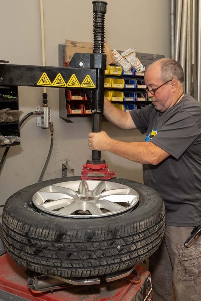 Our Mechanic is Working on a Tire in Clinton, MI - Phil's Complete Auto Repair