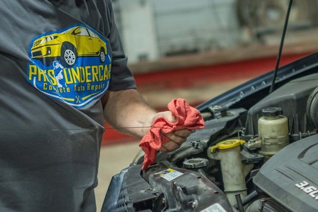 Our Technician Checks Engine Oil in Clinton, MI - Phil's Complete Auto Repair