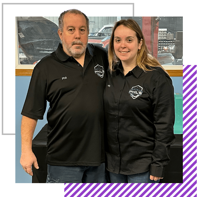 A man and a woman are posing for a picture together. | Phil's Complete Auto Repair