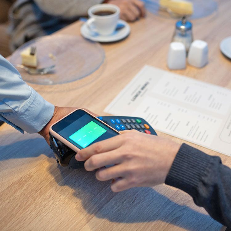 A person is using a smart phone to pay for something