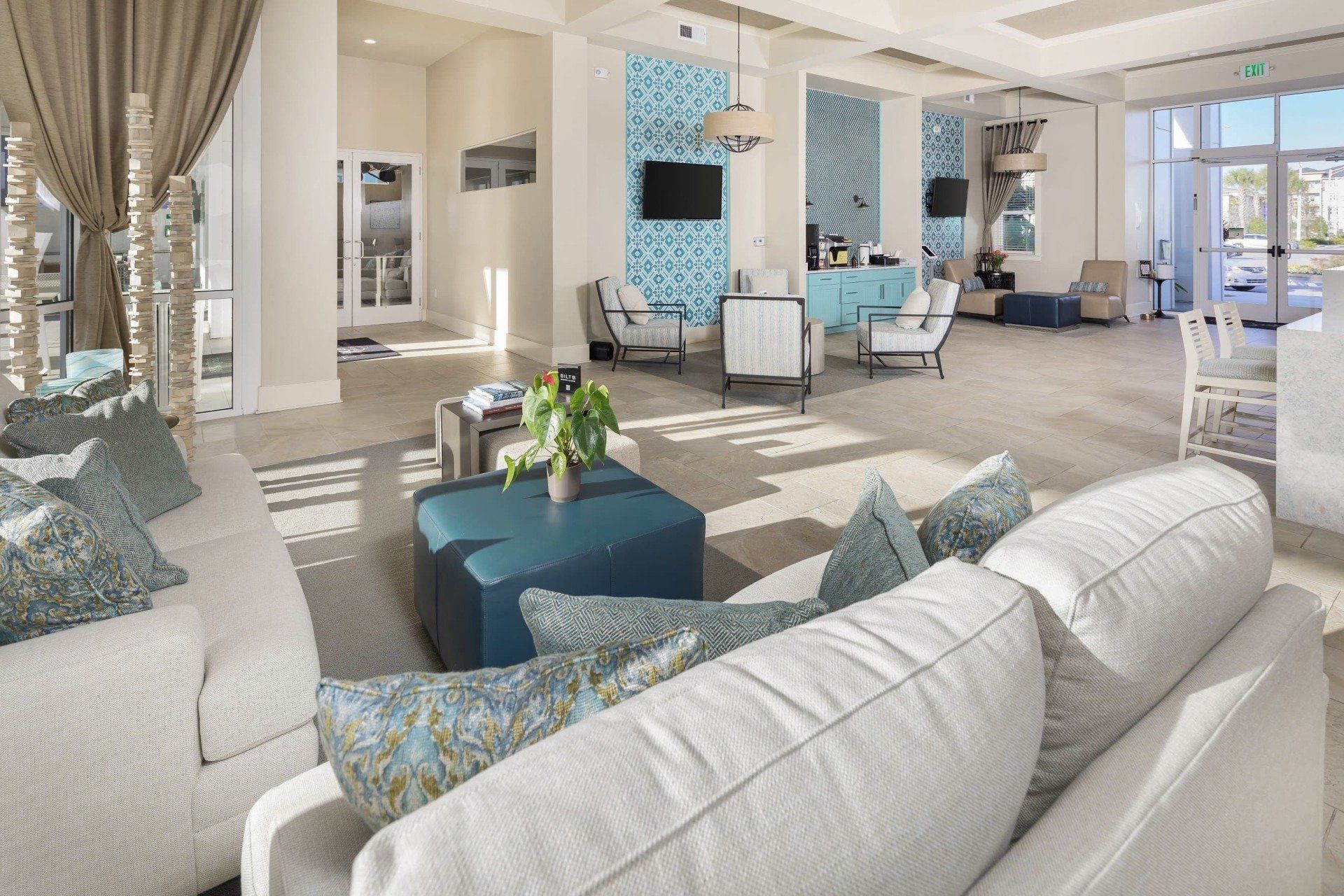 High Ceiling Clubhouse with Sofa and TV | The Elysian