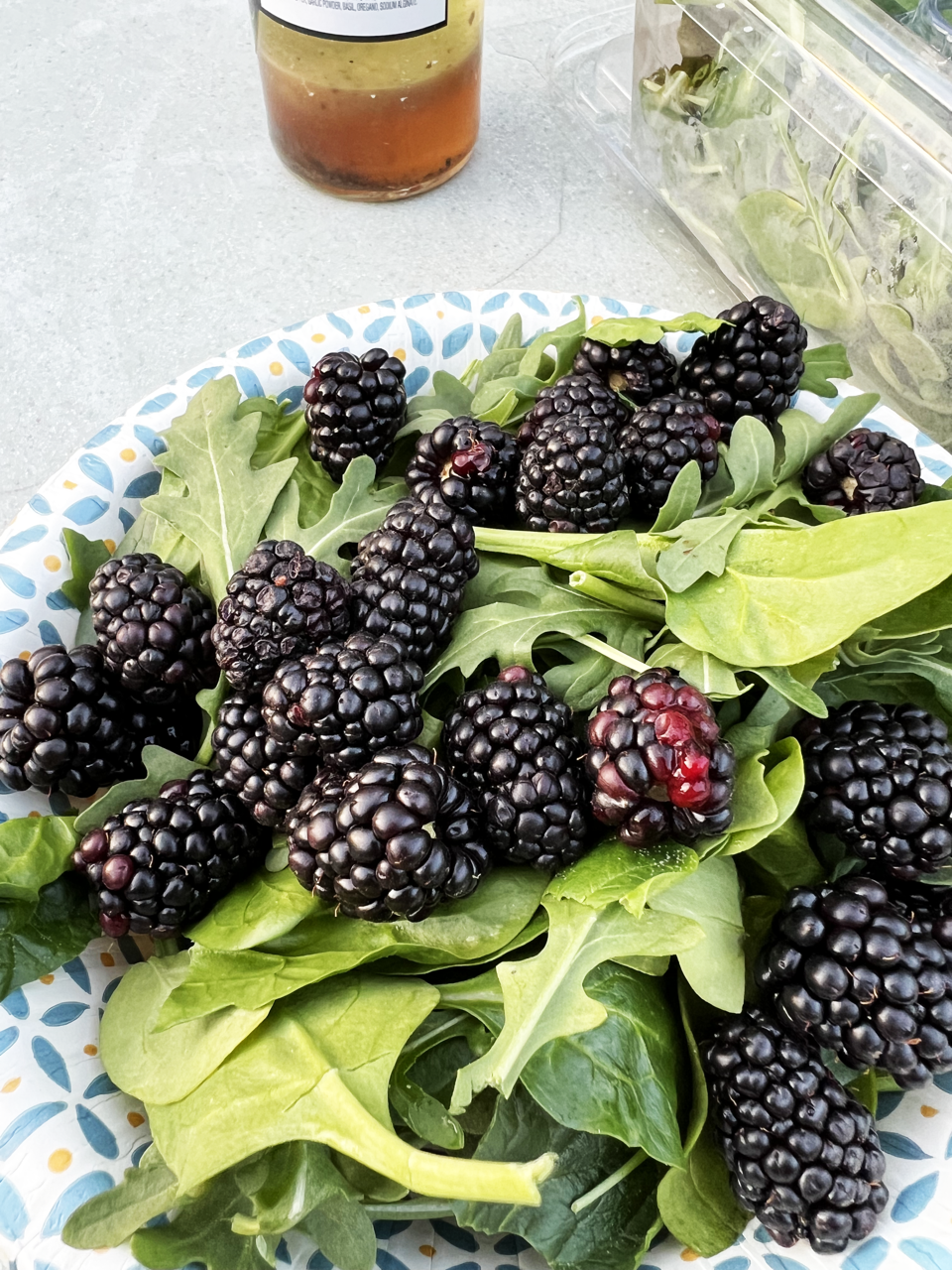 Blackberries Over Fresh Greens. Call Honey Puddle for Meal Prep Services in Hallsville, MO.
