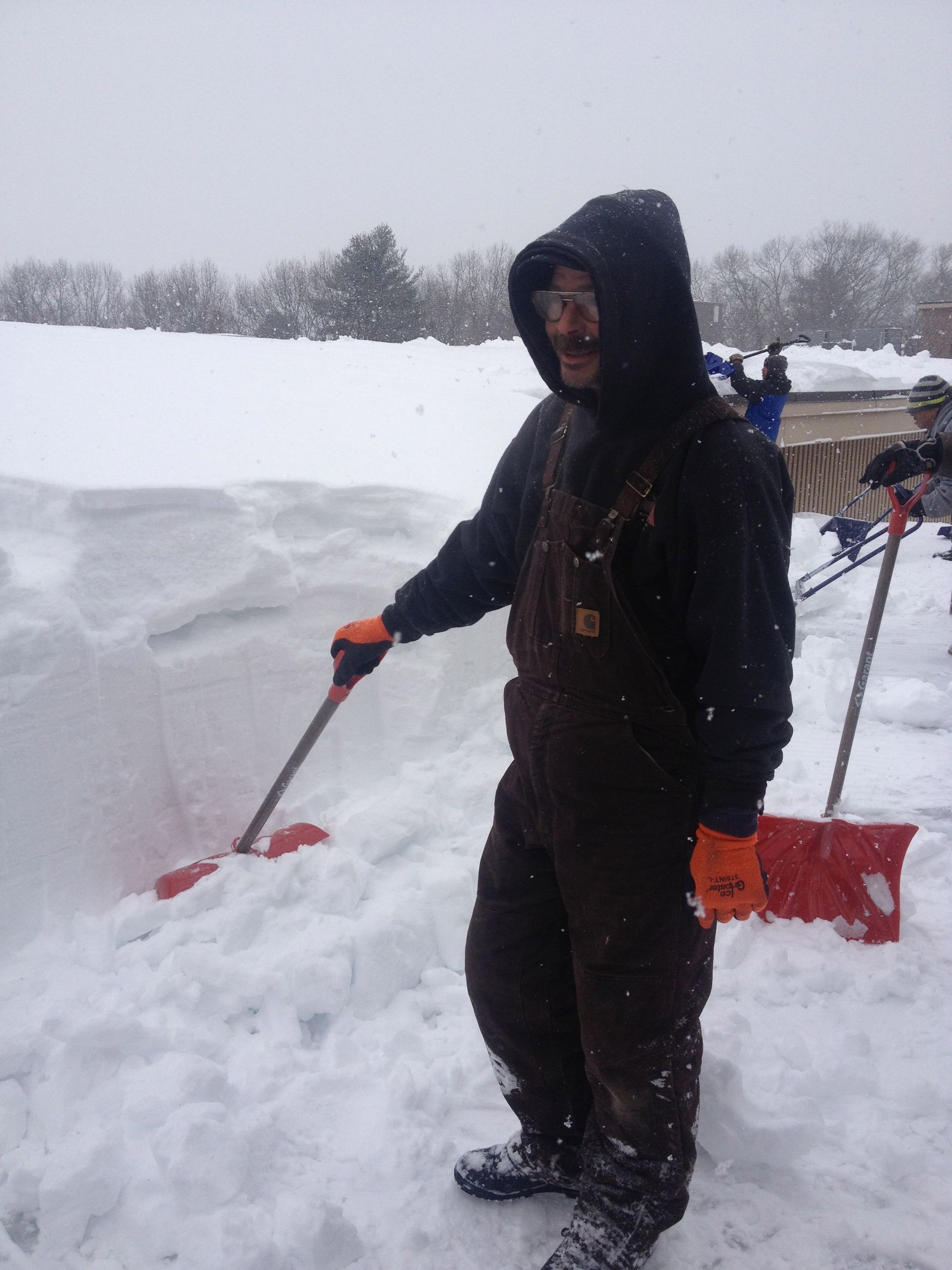 Man Removing Snow — Springfield, MA — Sun Roofing Inc