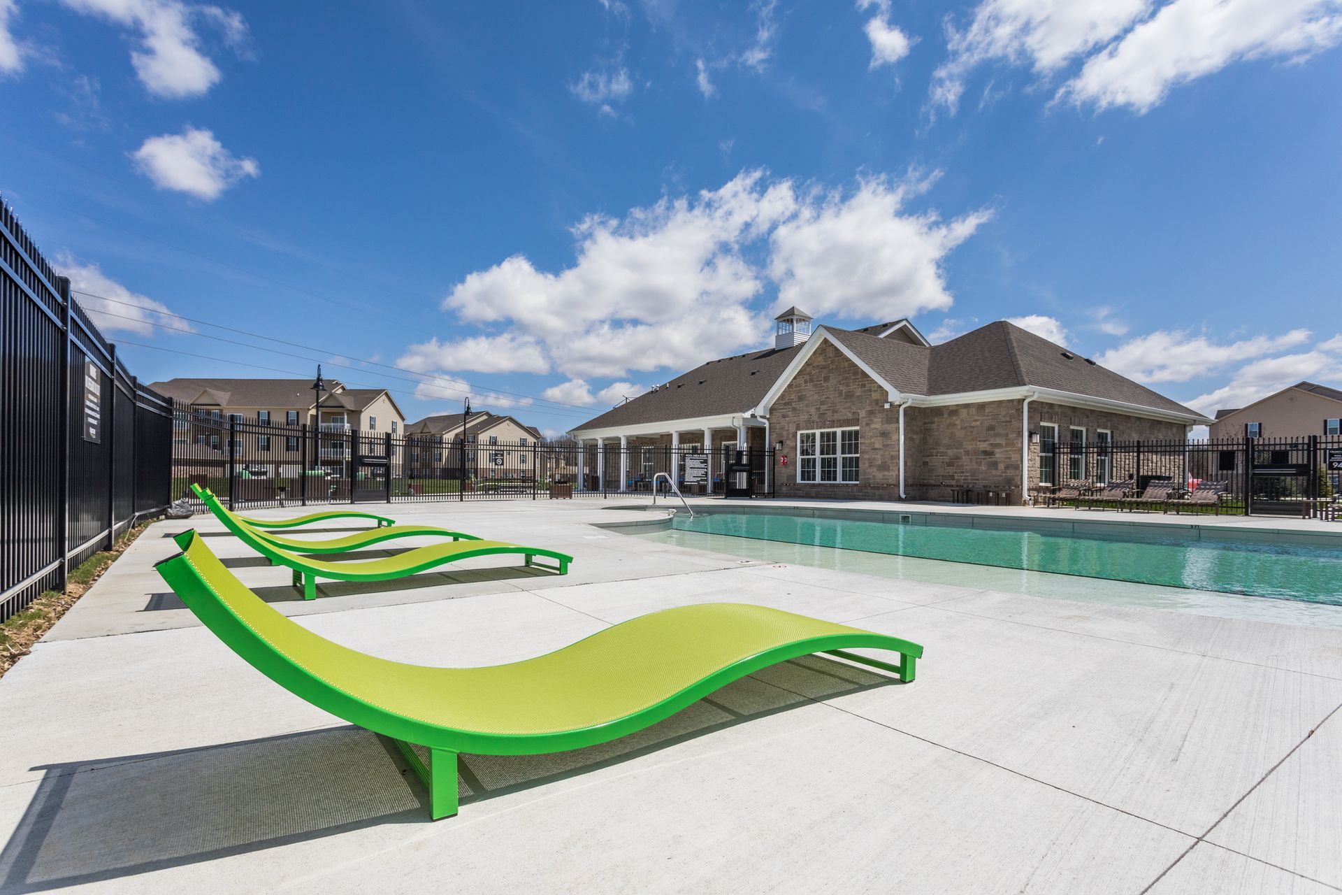 Exterior photo of pool area with seating