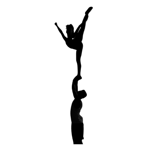 A silhouette of a man holding a cheerleader on his shoulders.