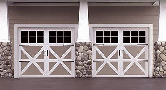 Carriage style garage door with windows and decorative hardware