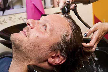 Man getting hair washed in Lakewood, WA