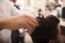 Man getting hair cut at Lakewood, WA