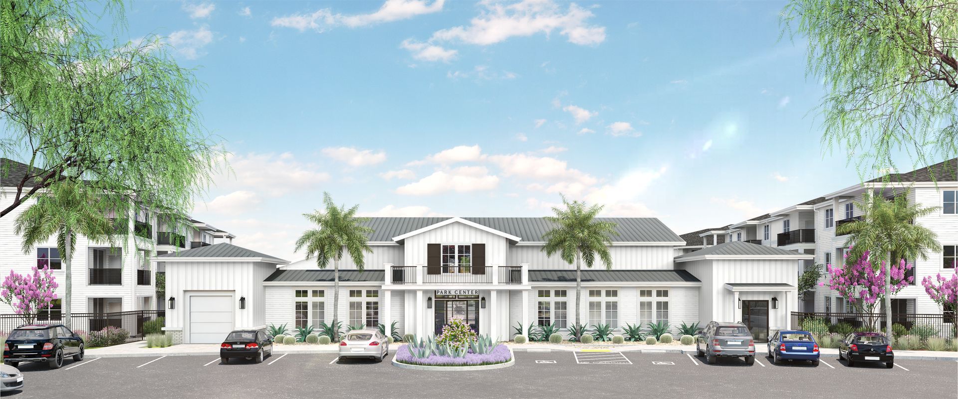 a white community building with palm trees