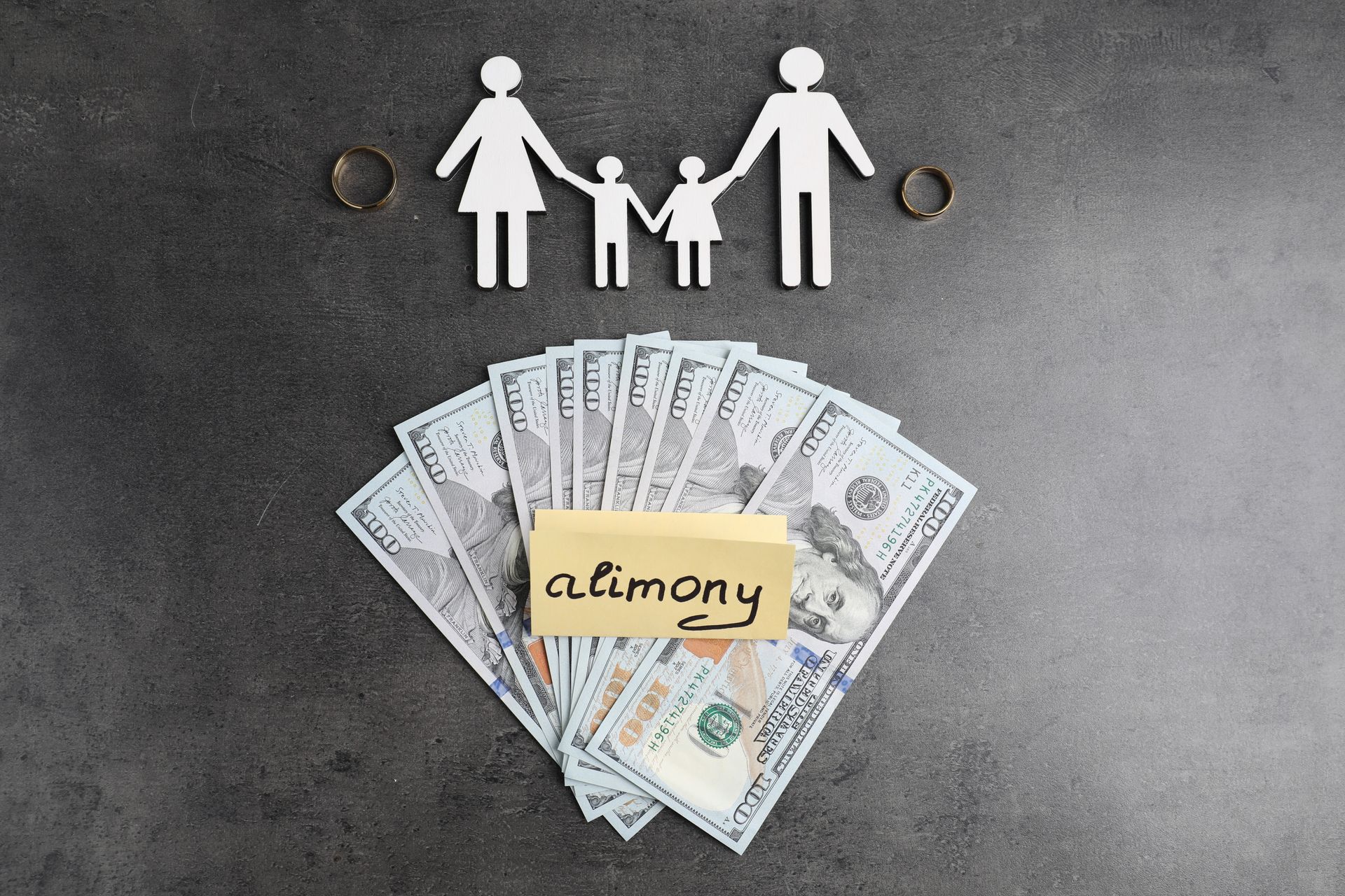 Paper family, money, wedding rings, and 