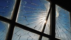 A close up of a broken glass on a black surface