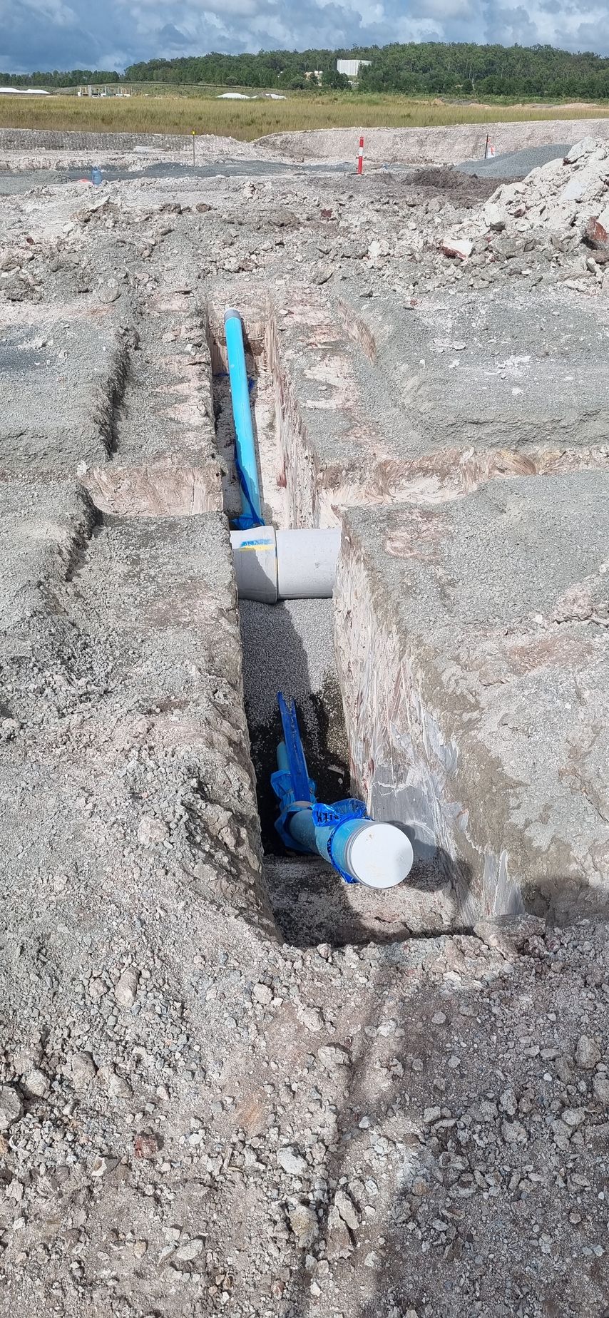 Blue and White Pipes in a Trench — Next Step Surveying in Caloundra, QLD