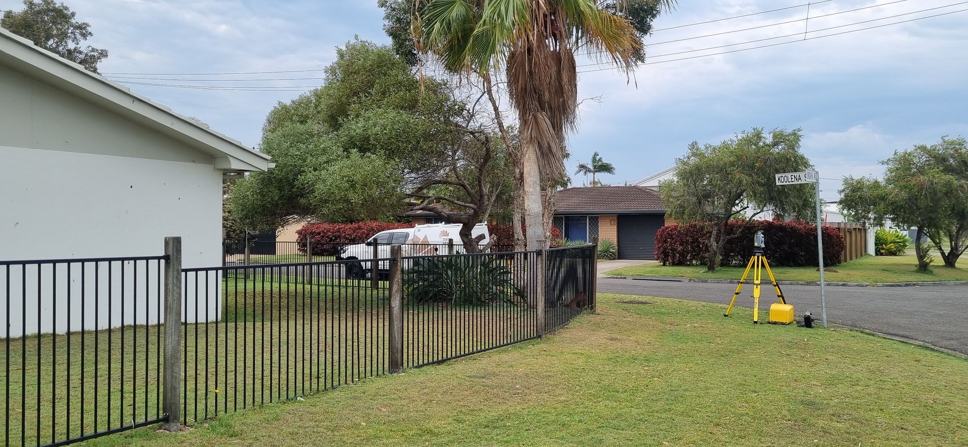 Suburban Street Scene With Houses, Palm Tree — Next Step Surveying in Toowoomba, QLD