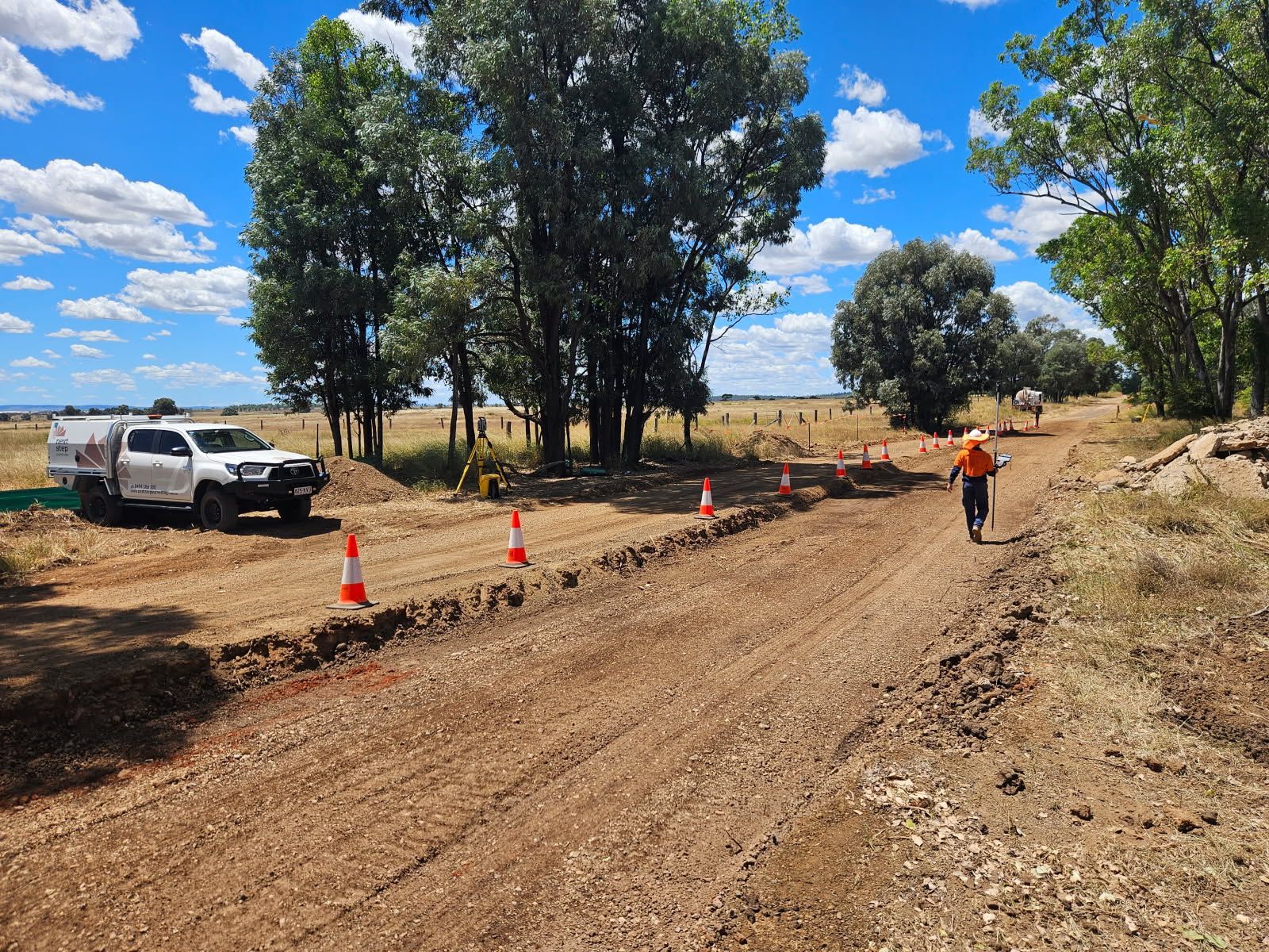 Dirt Road Construction Site With Truck — Next Step Surveying in Caboolture, QLD