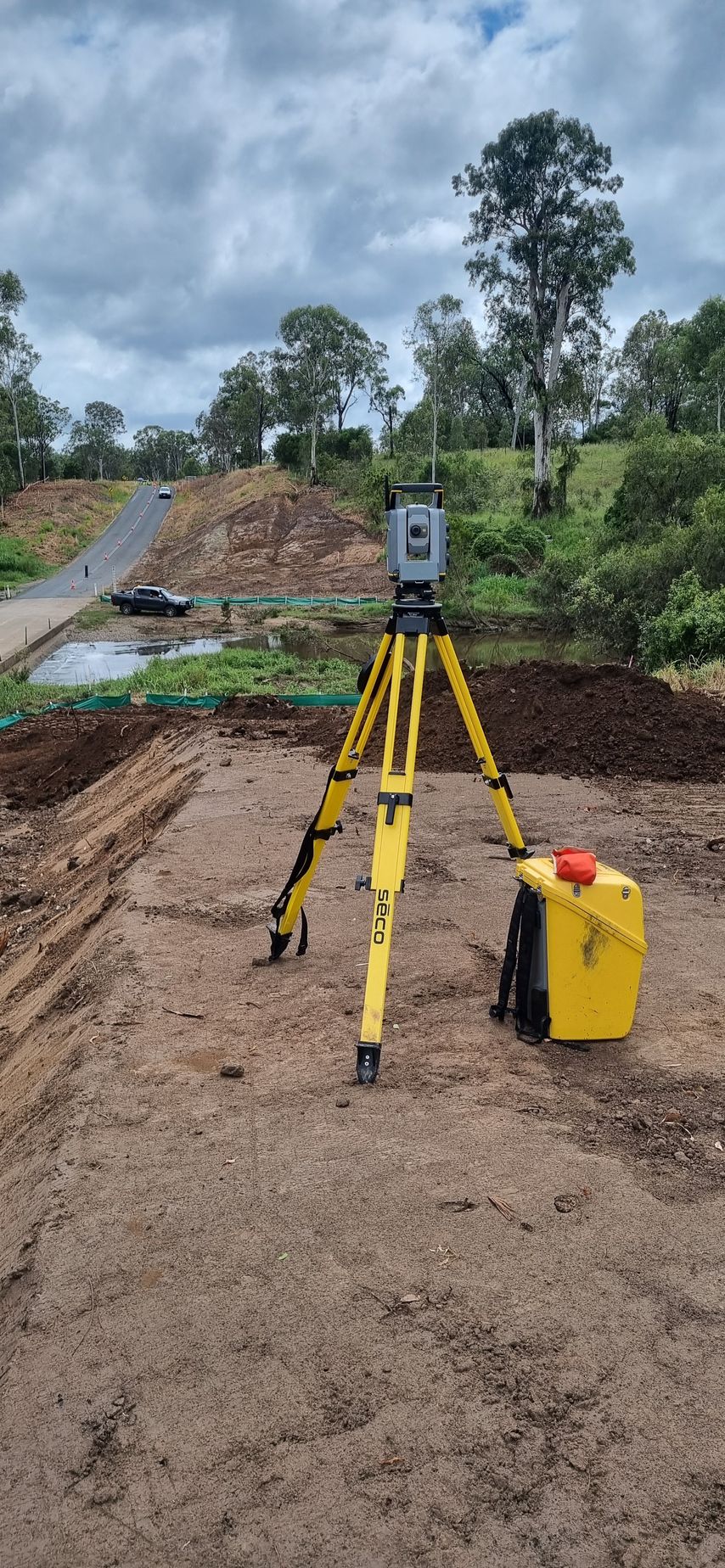 Surveying Equipment Set Up on a Dirt Surface Outdoors — Next Step Surveying in Kawana, QLD