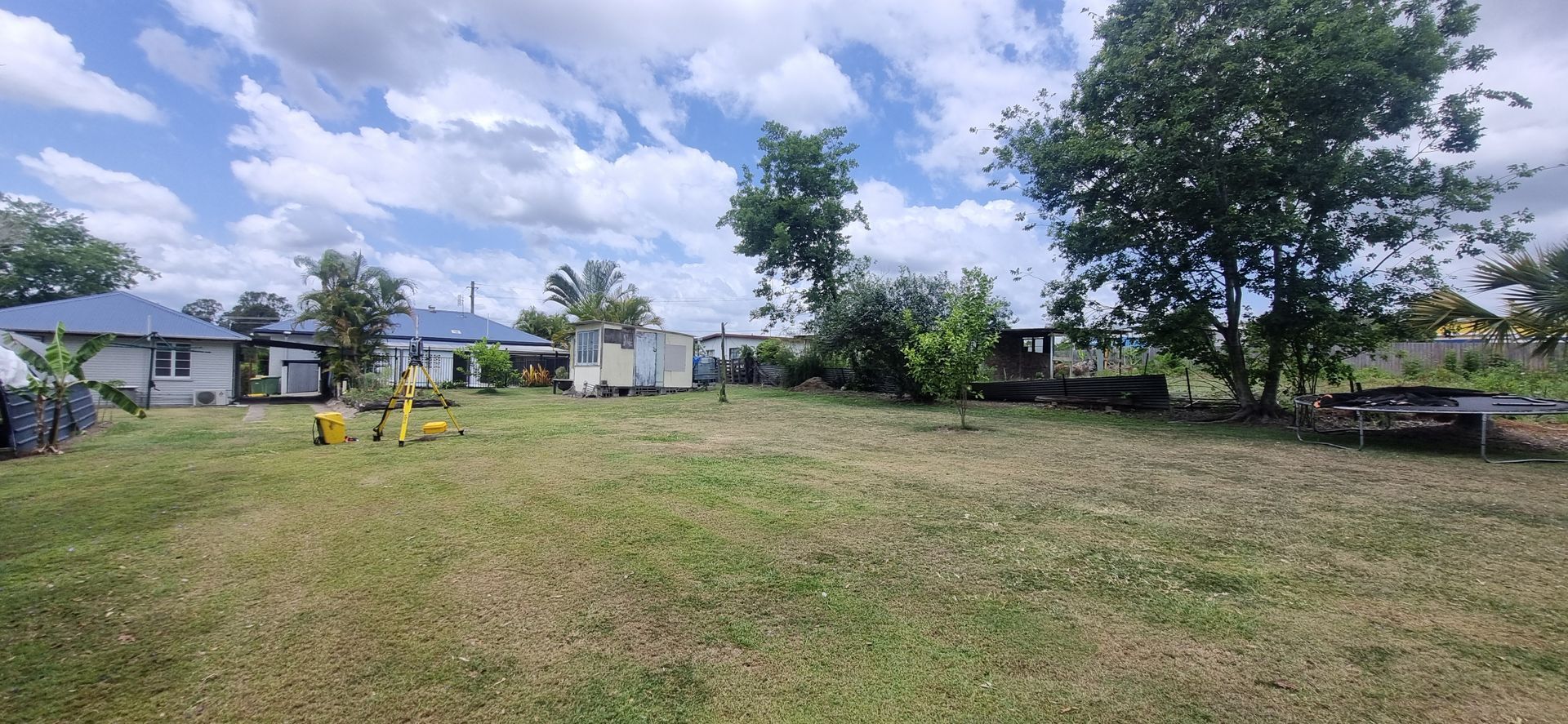 Grassy Field With Houses in the Background — Next Step Surveying in Nambour, QLD