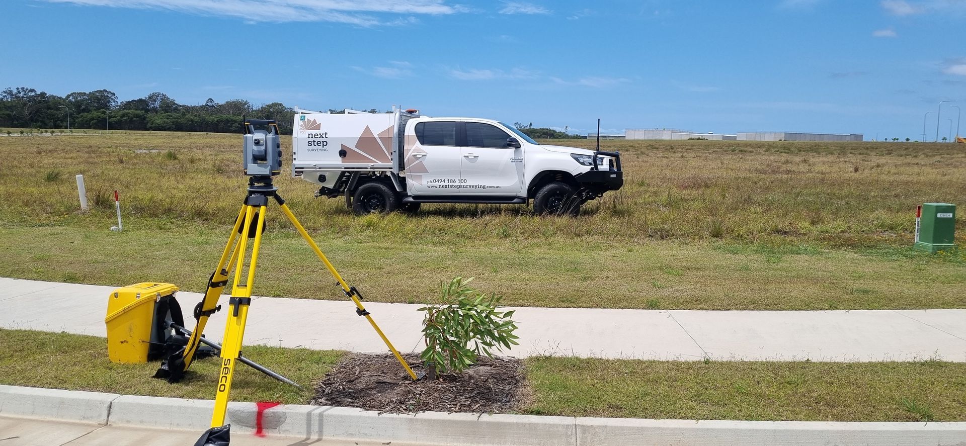 Survey Equipment Set Up Next to a White Truck — Next Step Surveying in Noosa, QLD
