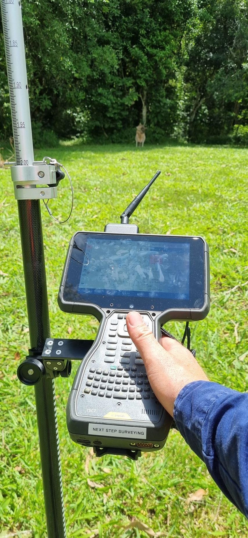Person Holding a Handheld Data Collector — Next Step Surveying in Ipswich, QLD