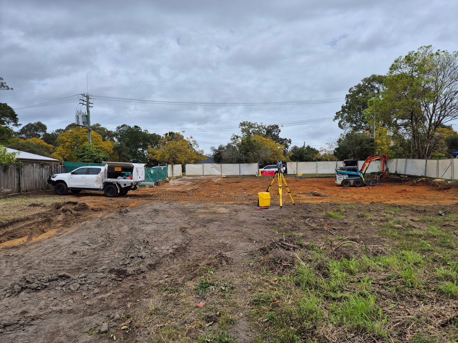 White Truck, Small Excavator, and Surveying Equipment — Next Step Surveying in Nambour, QLD
