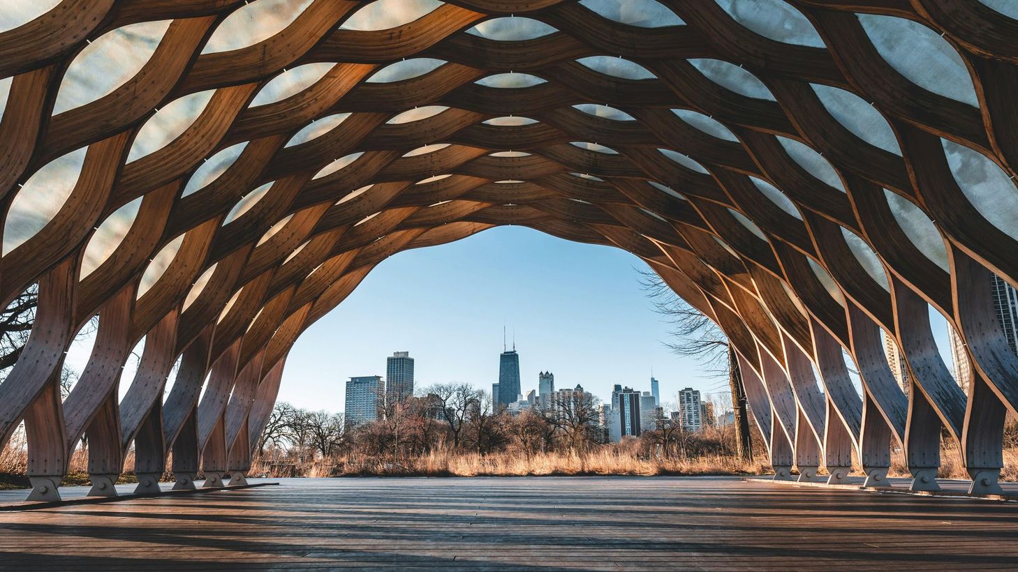 A wooden structure with a city skyline in the background.