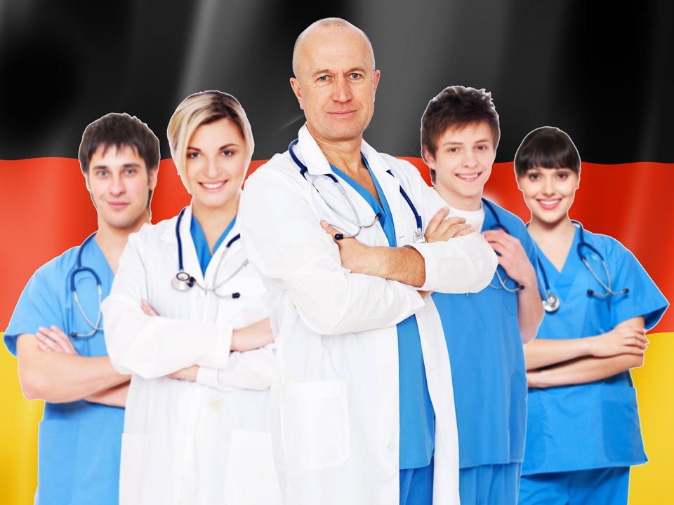 A group of doctors standing in front of a german flag