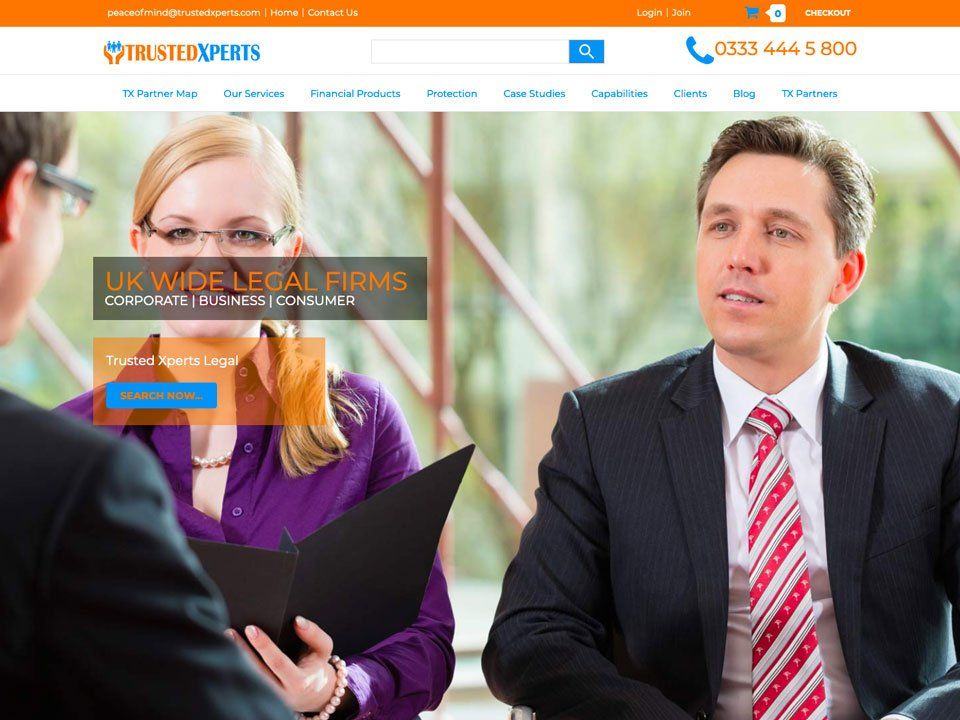 A man in a suit and tie is talking to a woman in a purple shirt