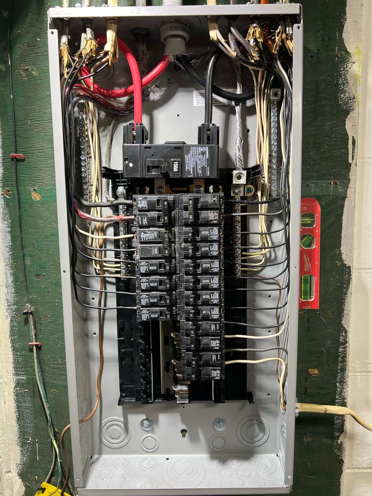 A electrical box with a lot of wires coming out of it.