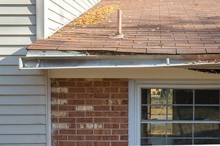 Damaged Gutter — Gutter Repair Services in Potomac, IL