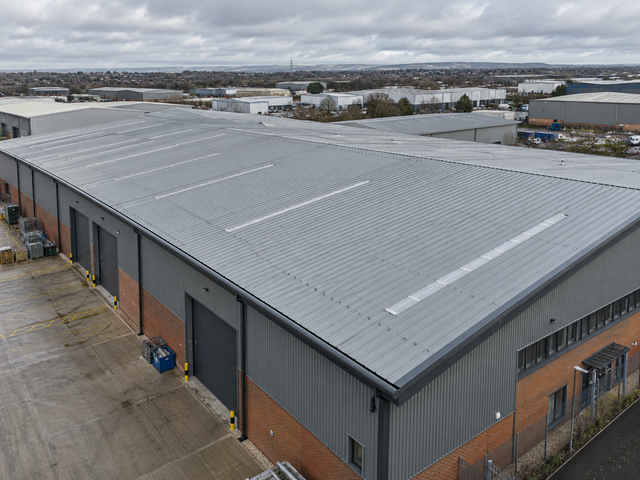 Profiled metal sheet roof with rooflights on a commercial unit