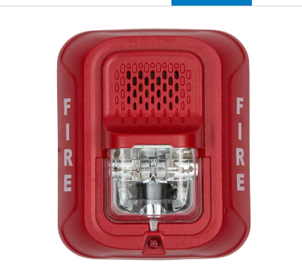 A red fire alarm with the word fire on it