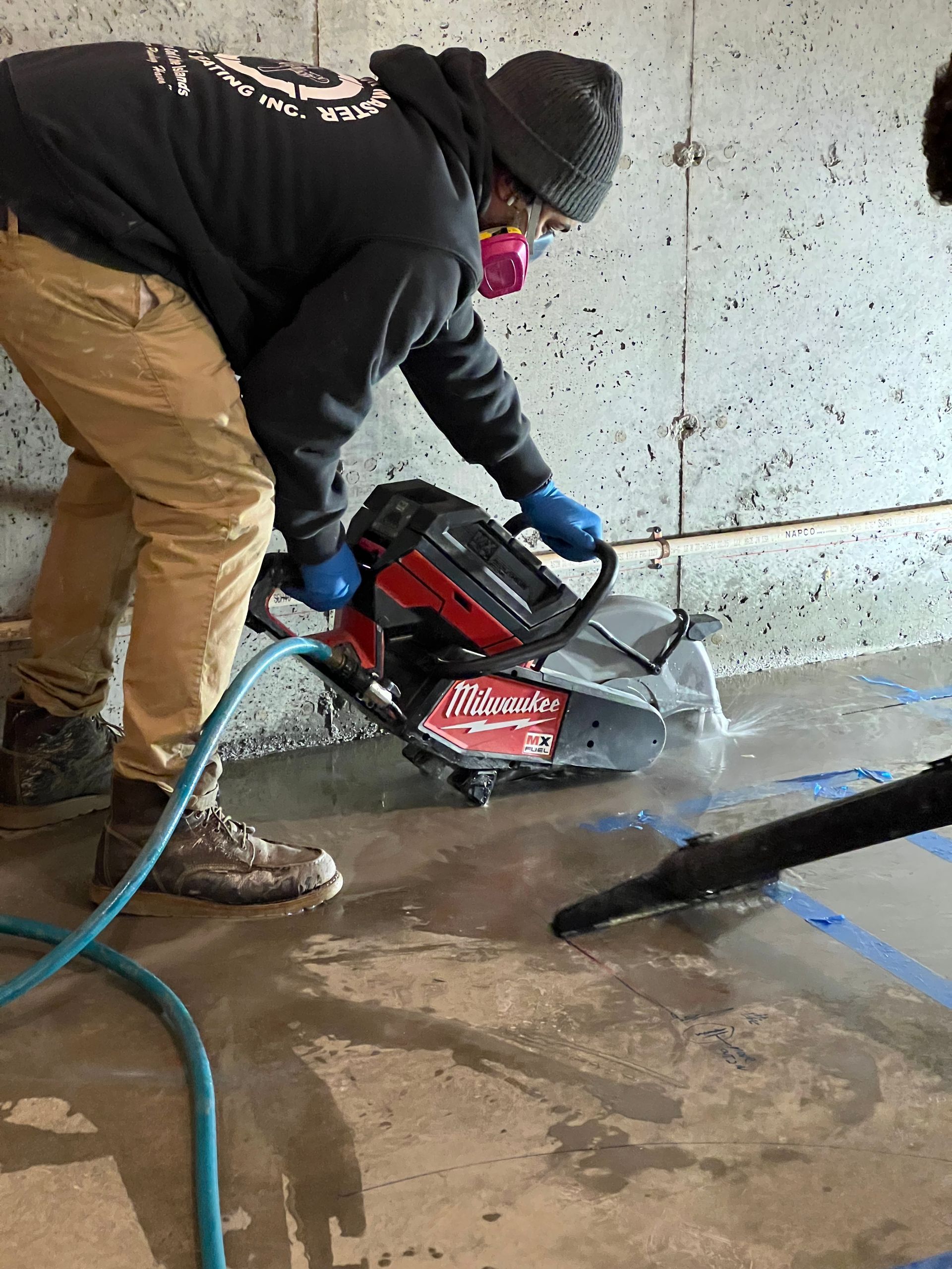 A person is fixing a sink with a wrench.