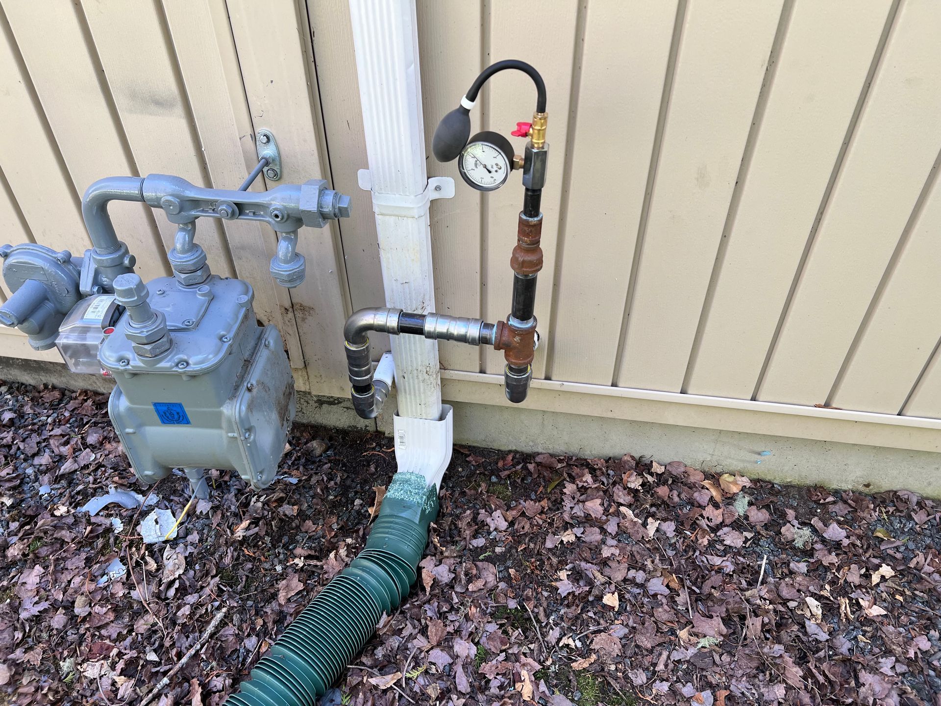 A bunch of pipes are stacked on top of each other in a factory.