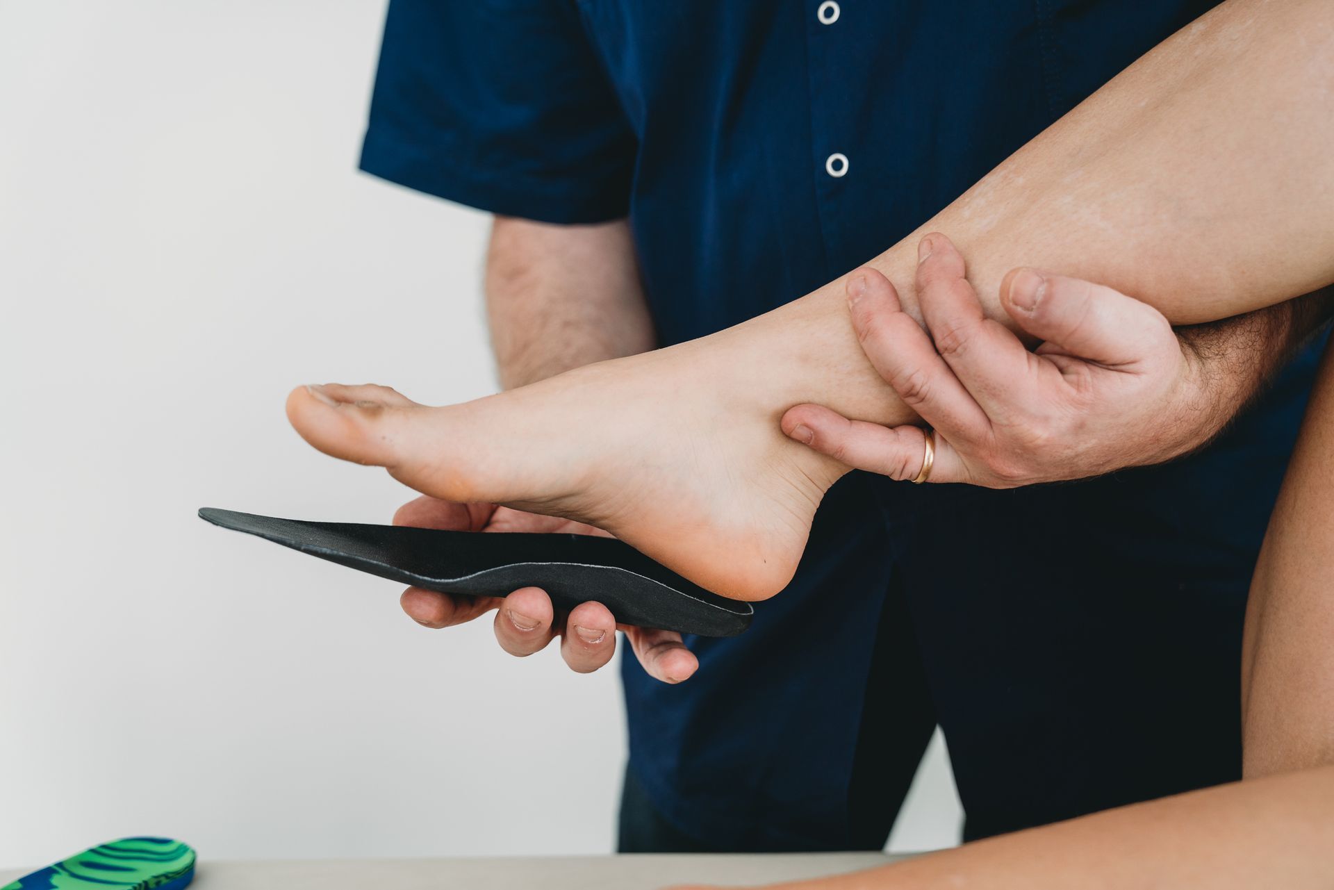 Young woman's foot on orthopedic insoles by St. Charles Podiatry expert podiatry physicians in Geneva, IL